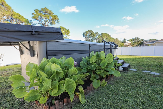 view of side of home featuring a yard