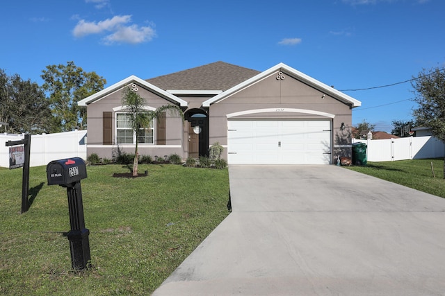 single story home featuring a garage and a front lawn