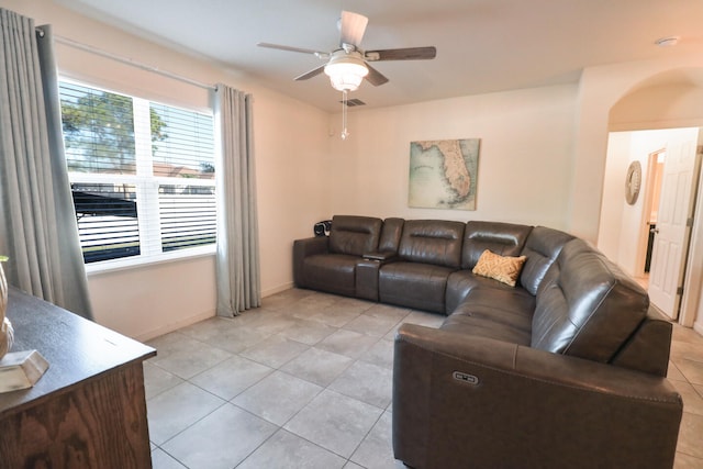 living room featuring ceiling fan and light tile patterned floors