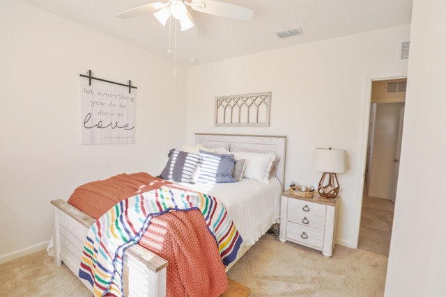 bedroom featuring ceiling fan and light carpet