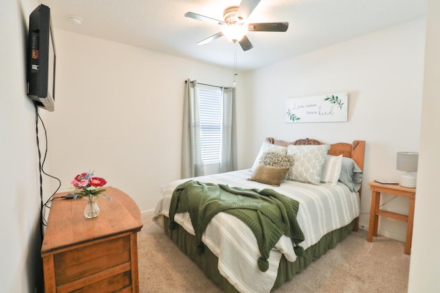 bedroom with light carpet and ceiling fan