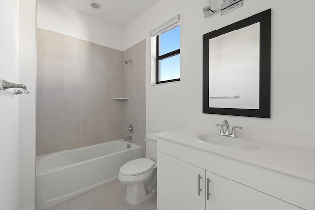 full bathroom featuring tile patterned floors, toilet, vanity, and tiled shower / bath