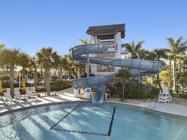 view of swimming pool featuring a water slide