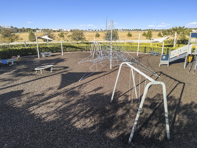 view of jungle gym featuring a rural view