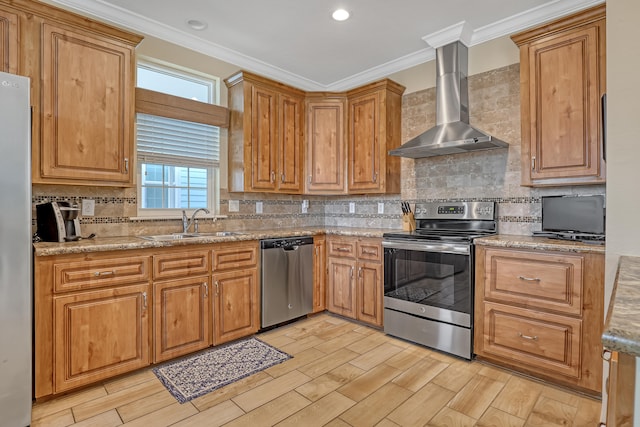 kitchen with wall chimney range hood, sink, ornamental molding, appliances with stainless steel finishes, and light stone counters