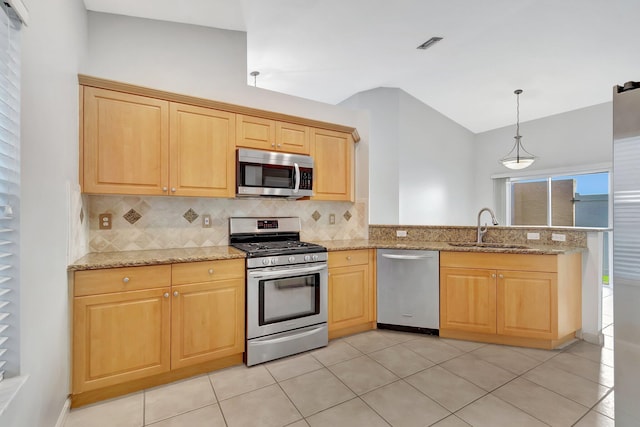 kitchen with decorative backsplash, appliances with stainless steel finishes, sink, light tile patterned floors, and decorative light fixtures