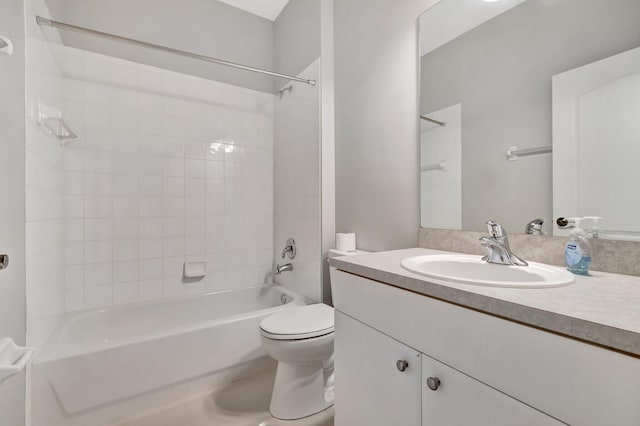 full bathroom featuring vanity, toilet, and tiled shower / bath