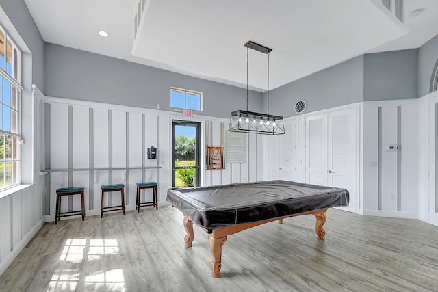 recreation room with a high ceiling, light wood-type flooring, and pool table