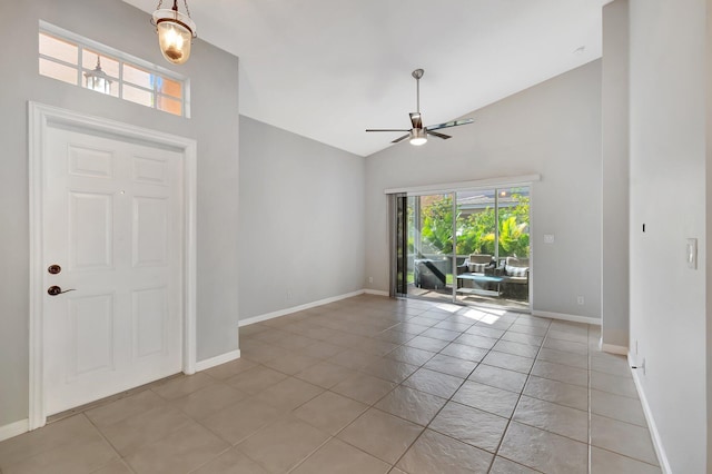 entrance foyer featuring ceiling fan, light tile patterned floors, and high vaulted ceiling