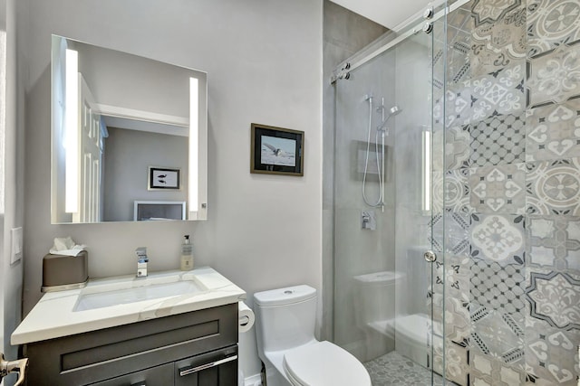 bathroom featuring walk in shower, vanity, and toilet