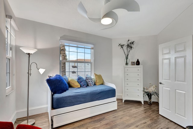 bedroom with hardwood / wood-style flooring