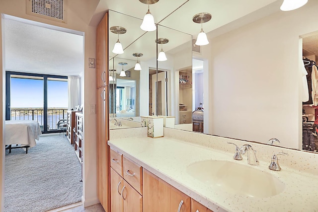 bathroom with vanity and a water view