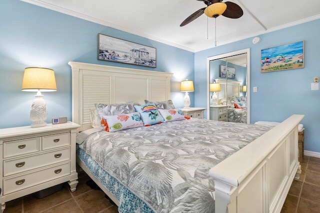 tiled bedroom with ceiling fan, a closet, and crown molding