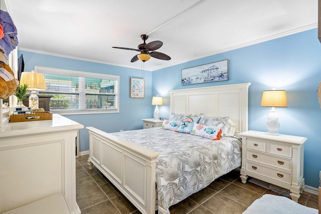 bedroom with baseboards, dark tile patterned floors, a ceiling fan, and crown molding