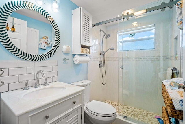 bathroom featuring an enclosed shower, toilet, decorative backsplash, vanity, and tile walls