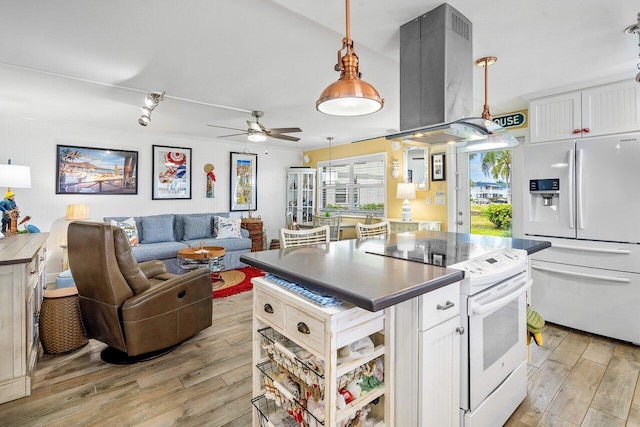 kitchen with island range hood, light hardwood / wood-style flooring, white cabinets, and white appliances