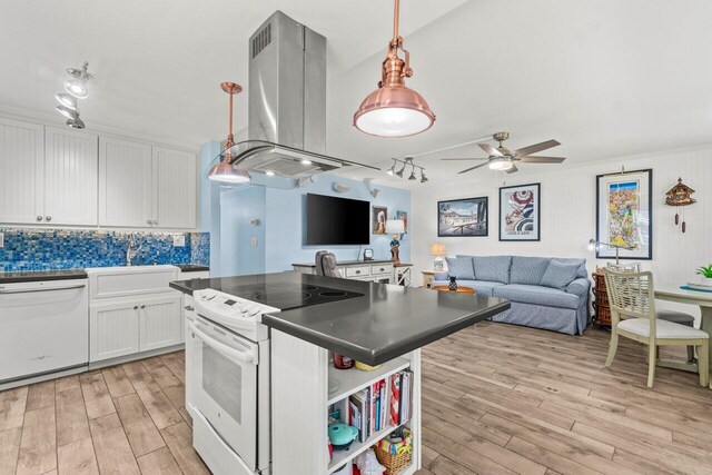 kitchen featuring white cabinetry, island exhaust hood, pendant lighting, white appliances, and light hardwood / wood-style floors