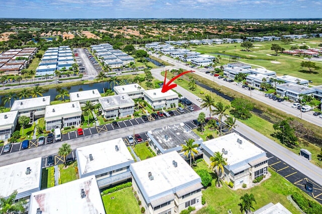 birds eye view of property with view of golf course