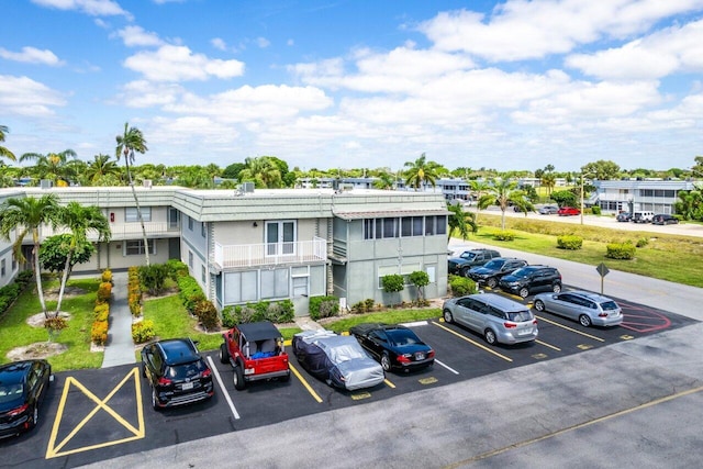 view of property featuring uncovered parking