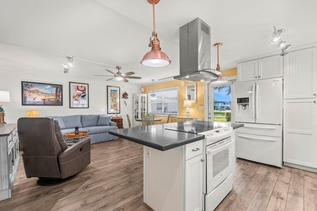 kitchen featuring dark countertops, white appliances, island exhaust hood, and light wood finished floors