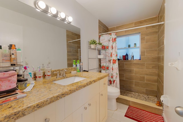 bathroom with tile patterned floors, toilet, vanity, and a shower with shower curtain