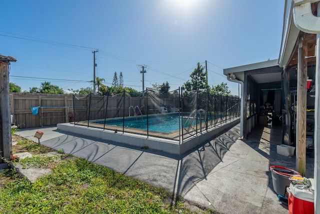 view of swimming pool with pool water feature