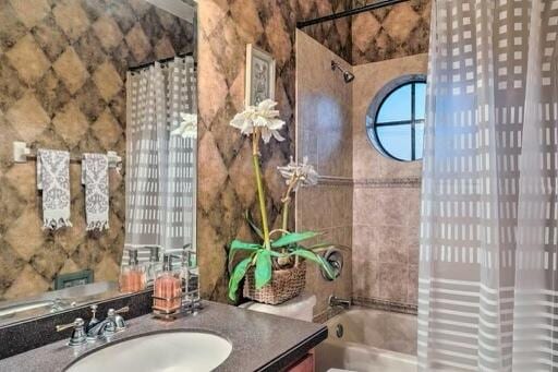 full bathroom with shower / bath combination with curtain, toilet, and vanity