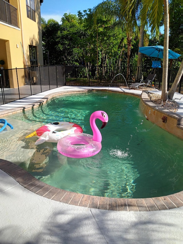 view of pool featuring pool water feature