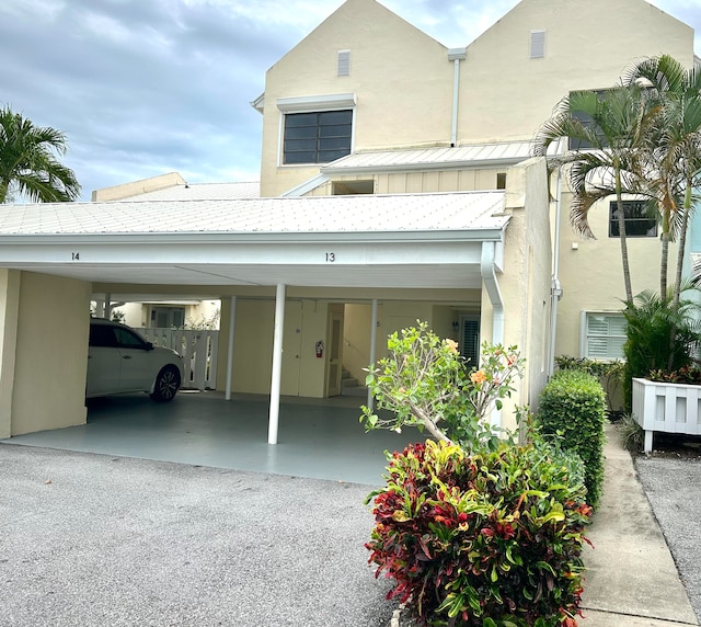 view of front of home with a carport