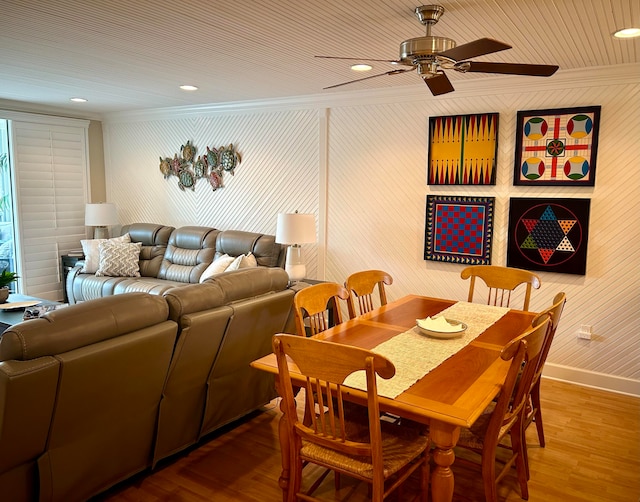 dining room with ceiling fan and wood-type flooring