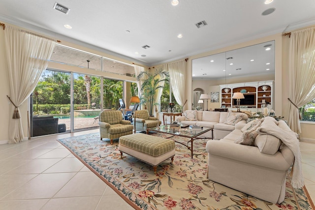 living room with light tile patterned flooring and crown molding