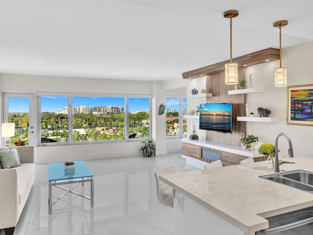 living room with light tile patterned flooring and sink