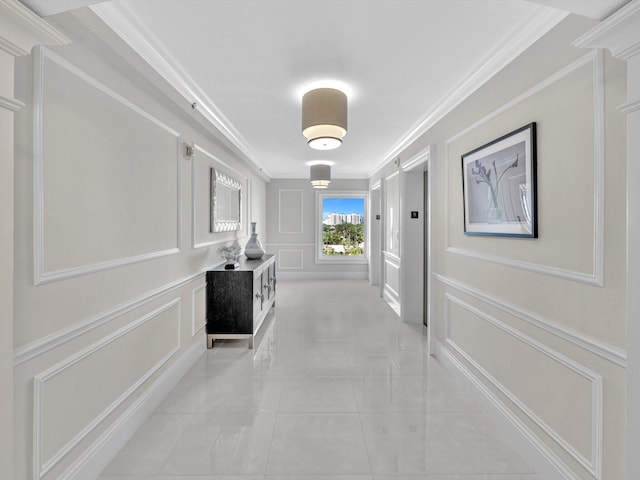 hall featuring light tile patterned flooring, ornamental molding, and elevator