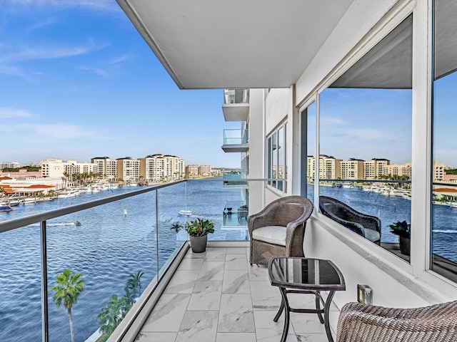 balcony featuring a water view