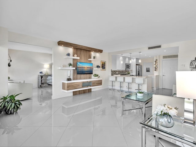 living room with light tile patterned floors