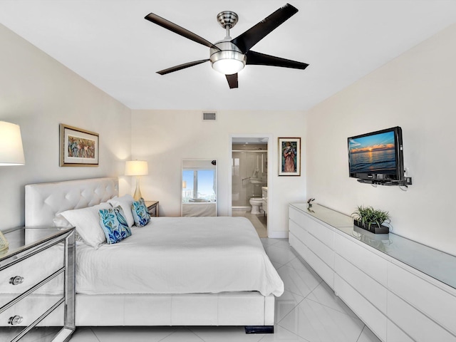 tiled bedroom with ceiling fan and ensuite bathroom