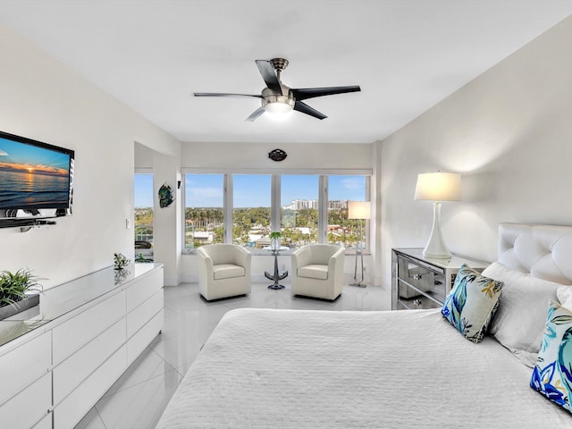 bedroom with ceiling fan and light tile patterned floors