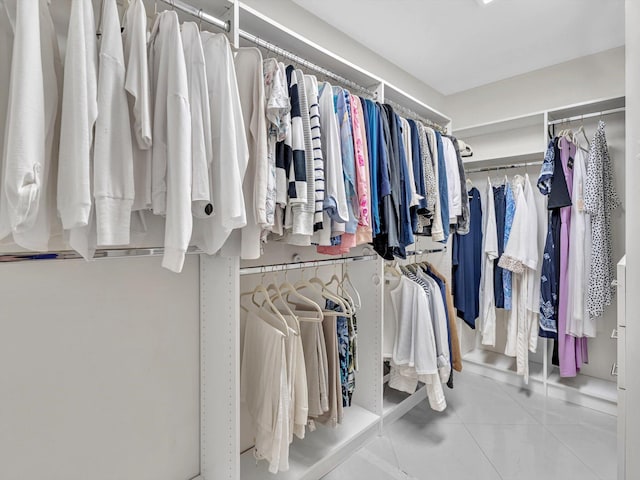 spacious closet featuring tile patterned flooring