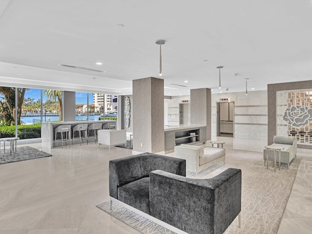 building lobby featuring a water view