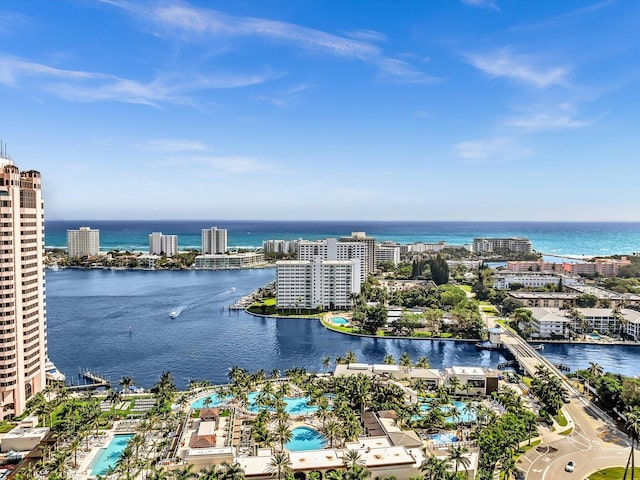 birds eye view of property with a water view