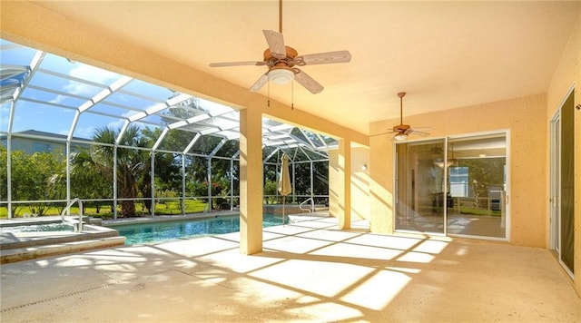 view of swimming pool with a patio, glass enclosure, and a hot tub