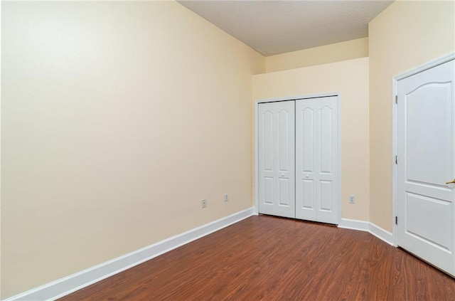 unfurnished bedroom featuring hardwood / wood-style flooring