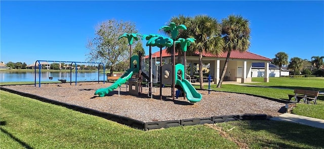 view of playground with a water view and a yard