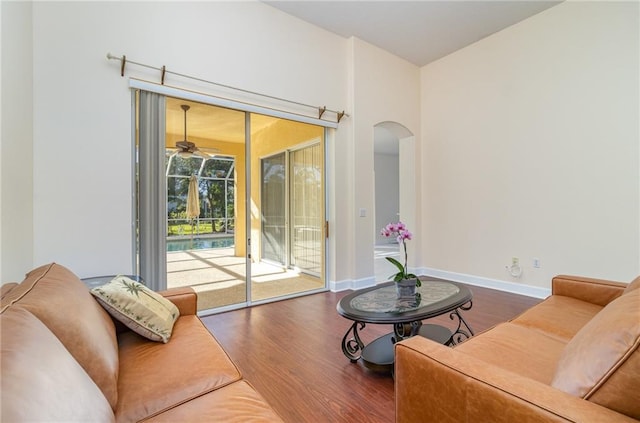 living room featuring hardwood / wood-style flooring and ceiling fan