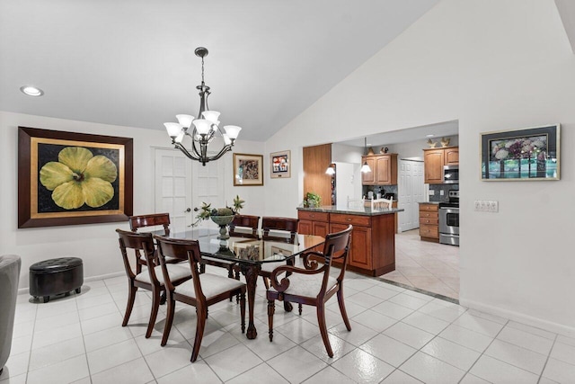 dining area featuring light tile patterned floors, an inviting chandelier, and lofted ceiling