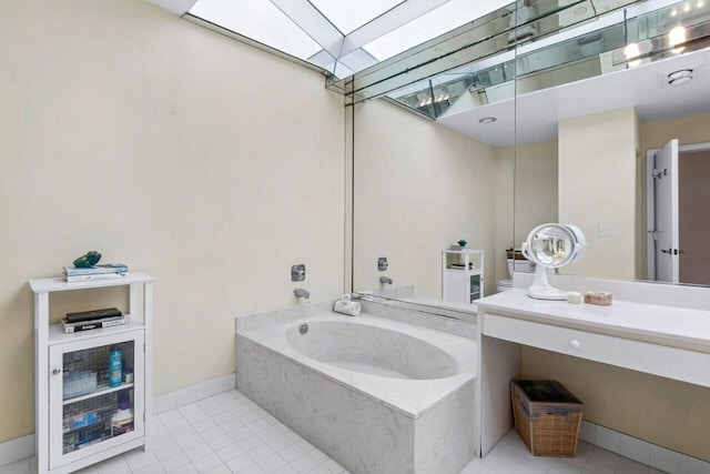 bathroom with a bathtub, vanity, and tile patterned flooring