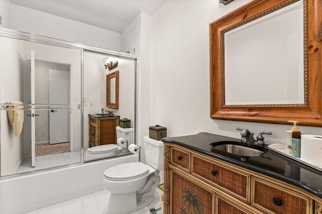 full bathroom with tile patterned flooring, vanity, toilet, and bath / shower combo with glass door