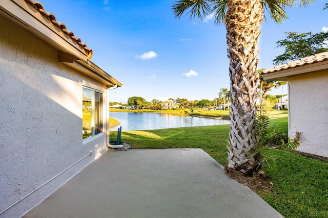 view of patio featuring a water view