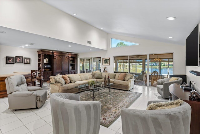 tiled living room with high vaulted ceiling