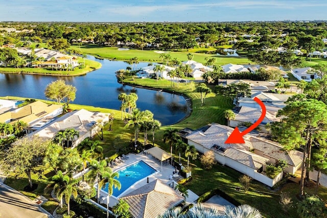 birds eye view of property with a water view